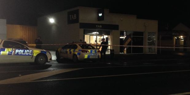 Police at the incident at the South Dunedin TAB. Photo: Linda Robertson / Otago Daily Times