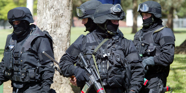 AUCKLAND, NEW ZEALAND - NOVEMBER 07: Members of the Police Armed Offenders Squad await instructions during a training exercise at James Cook High School in Manurewa, Thursday. (Photo by Michael Brad