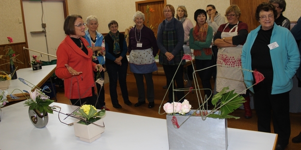 Visiting tutor Val de Latour of Palmerston North discusses the principles of modern floral design with members of the Dannevirke Floral Art group last week. Photo / Christine McKay