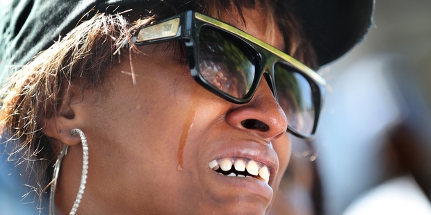 Diamond Reynolds weeps after the shooting of her boyfriend by police.