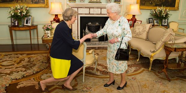 The Queen welcomes Theresa May at the start of an audience in Buckingham Palace, London. Photo / AP