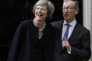 New British Prime Minister Theresa May and her husband Philip May stand on the steps of 10 Downing Street. Photo / AP