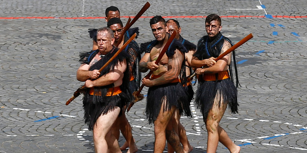 Maori warriors from New Zealand lead a march on the Champs Elysees avenues during the Bastille Day parade in Paris, Thursday, July 14, 2016. Photo / AP