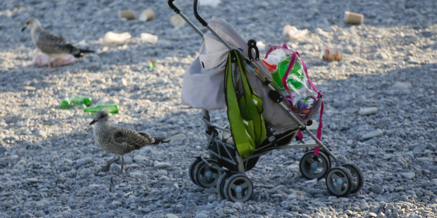 A baby carriage is left on the beach a day after a truck mowed through revelers in Nice, southern France, Friday. Photo / AP