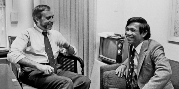 In this 1980 photo, Sydney Schanberg, left, talks with Dith Pran at the New York Times office in New York. Photo / AP