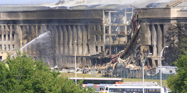 Smoke comes out from the Southwest E-ring of the Pentagon building September 11, 2001. Photo / Getty