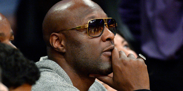 Lamar Odom was escorted from a flight after fellow passengers saw the celebrity vomiting before take off. Photo/AP