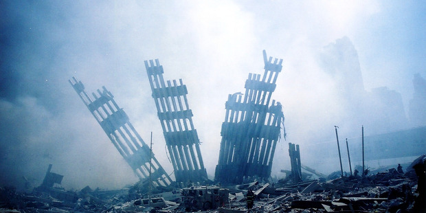 The rubble of the World Trade Center smoulders. Photo / Getty