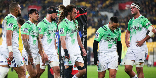 Highlanders players look on in disappointment after a Hurricanes try during their round 14 Super Rugby match. Photo / Getty