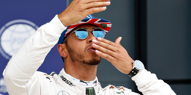 Lewis Hamilton blows kisses to the crowds after qualifying in pole position. Photo / Getty Images