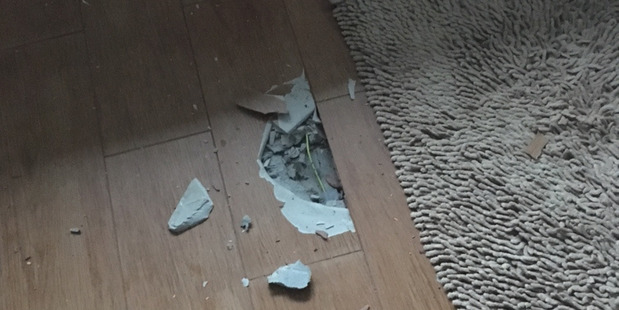 Damage to the bathroom floor of a house in Clevedon after it was struck by lightning. Photo / Supplied