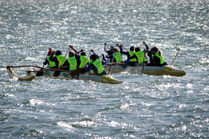 Tauranga policewomen jumped in a waka and paddled their way across Pilot Bay with a special baton to celebrate 75 years of women in blue. PHOTO/ANDREW WARNER