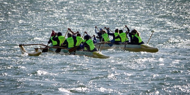 Tauranga policewomen jumped in a waka and paddled their way across Pilot Bay with a special baton to celebrate 75 years of women in blue. PHOTO/ANDREW WARNER
