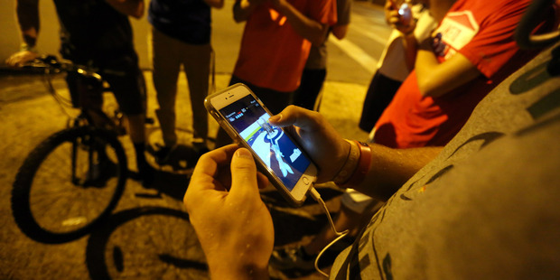 The Pokemon Go game prompted police to remind players to be mindful of dangers in the real world. Picture / AP