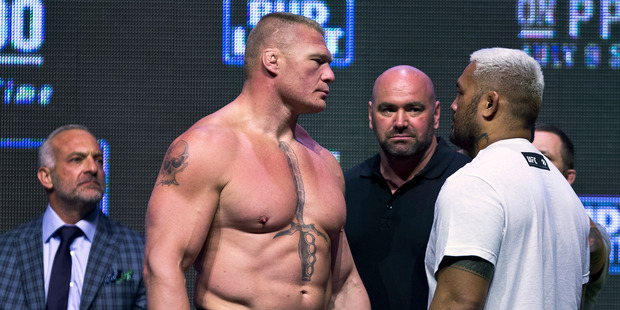Brock Lesnar, left, looks at Mark Hunt during the UFC 200 weigh-ins in Las Vegas. Photo / AP.