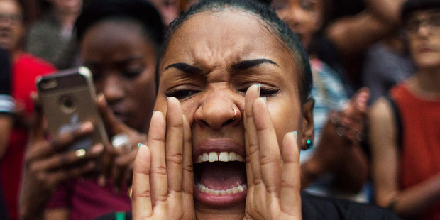 A protestor shouts slogans as they march from Manhattan to Brooklyn in New York. Photo / AP