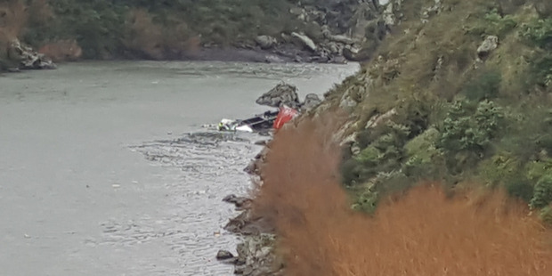 A truck that plunged off a steep cliff into the Manawatu Gorge. Photo / Will Foley
