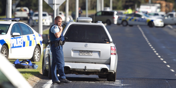 Police at the scene of the shooting on Te Ngae Rd. Photo / Ben Fraser