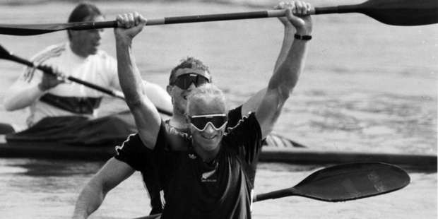 Paul MacDonald and Ian Ferguson raise their arms in the air as the line judge calls them in first and the gold medal in the K-2 500 at the Han Regatta Course. Photo / NZH Archives