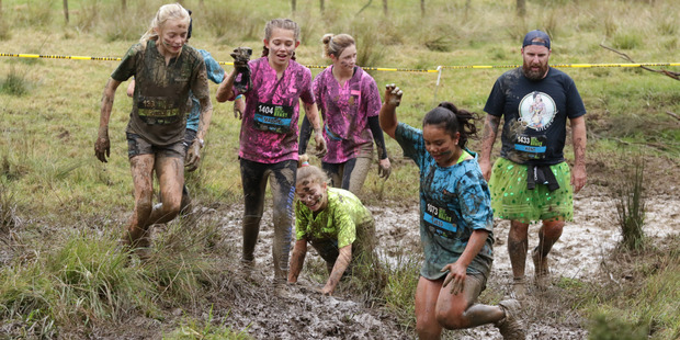 Jessica Wech of Kamo enthusiastically tackles a boggy section of the course during The Beast in the Bay of Islands. Photo / Jason Milich, Action Images Northland