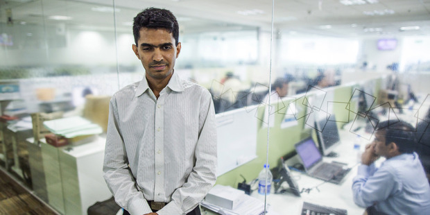 Vishal Agrawal, a foreign exchange trader at Standard Chartered, at the bank's office in Mumbai, India. Photo / Bloomberg photo by Prashanth Vishwanathan