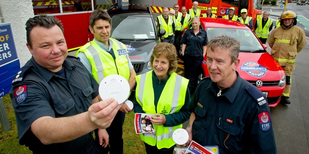 (From left) Paul Hughes, officer in charge of Taradale Volunteer Fire Brigade; Senior Constable Pete Gimblett of the Taradale police; Sandy Ibbotson, Napier Community Patrol organiser; and Darren Walker, Taradale Volunteer Fire Brigade. Photo / Warren Buckland