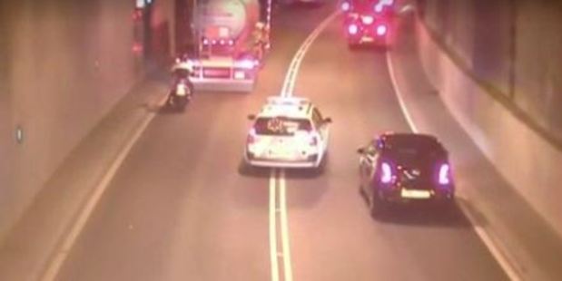 Video footage shows a driver weaving through traffic in a 'fake' ambulance. Photo / AFP Video