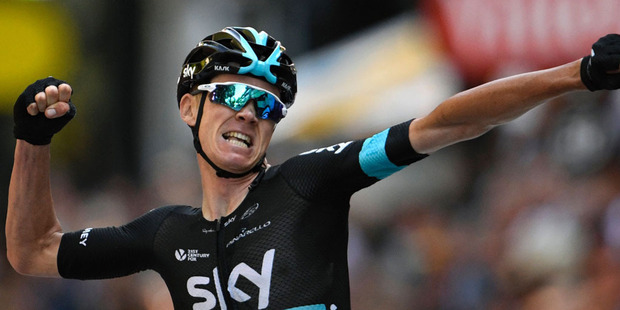 Great Britain's Christopher Froome celebrates as he crosses the finish line of the 184 km eighth stage of the 103rd edition of the Tour de France. Photo / Getty Images.