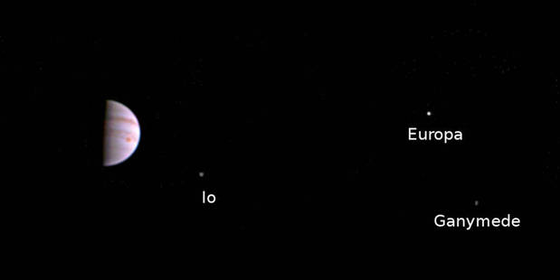 Jupiter and its three largest moons photographed by Juno's cameras from 4 million kilometres away. Soon the Juno spaceship will send back never-seen-before close-up views of the planet. Photo / Nasa
