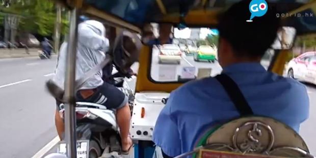 Within moments, two men on a motorbike rode past the tuk tuk and grabbed Eric Lau's bag from in front of him. Photo / GOTrip, Facebook