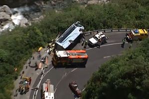 Twelve people were injured, some seriously, after a bus toppled on its side in a collision with a car in the Otira Gorge in Arthurs Pass. Photo / 3 News