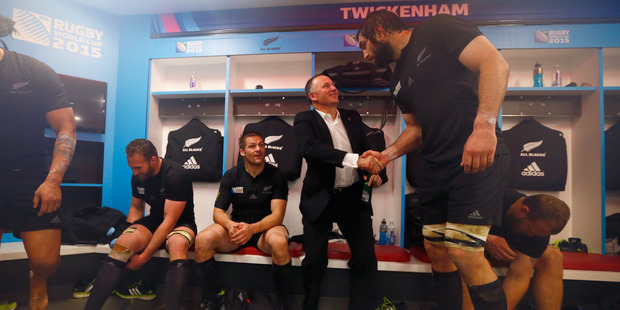 Sam Whitelock towers over Prime Minister John Key in this photo taken during the recent Rugby World Cup.