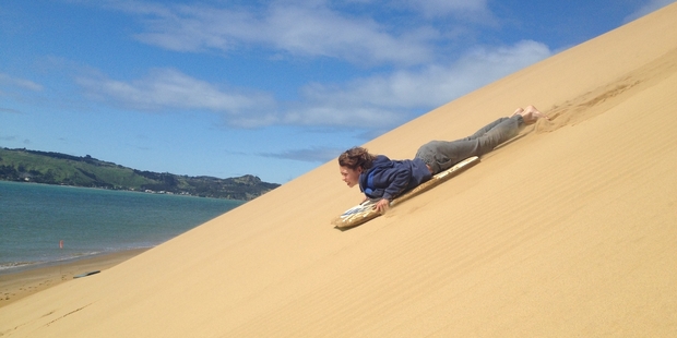 Johnny Cox flies down the Hokianga dunes. Photo / Rob Cox
