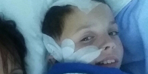 Kade Phillips recovering in hospital after being struck with an electric fence post on his way to school. Photo / Supplied