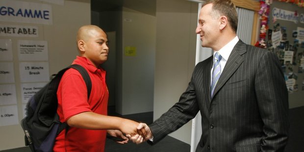 John Key meets Antoni Kalekale in 2007 after the boy egged his car. Photo / Glen Jeffries