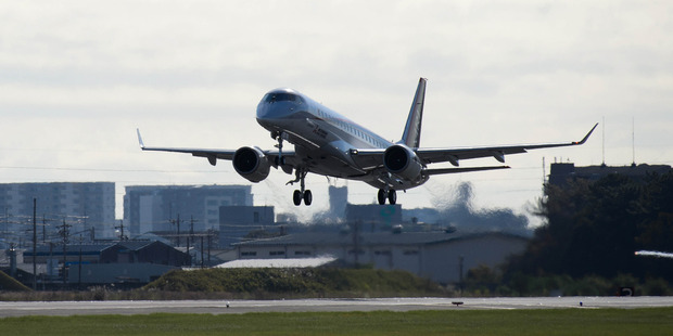 Mitsubishi's Regional Jet takes off for its first flight at Nagoya Airport in November half a century after Japan last introduced a new passenger plane. Bloomberg / Akio Kon