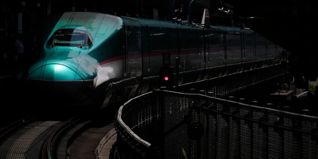 An East Japan Railway E5 series Shinkansen bullet train on the platform at Tokyo Station. Bloomberg / Kiyoshi Ota