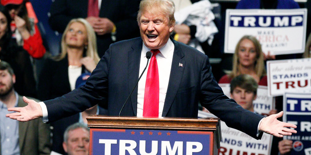 Security removed the woman from the rally even though she stood quietly, not saying anything. Photo / AP
