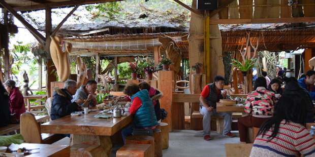 Visitors eat Taiwanese aboriginal cuisine at the Dajeeli Tribe Restaurant in Taiwan. Photo / Eli Orzessek