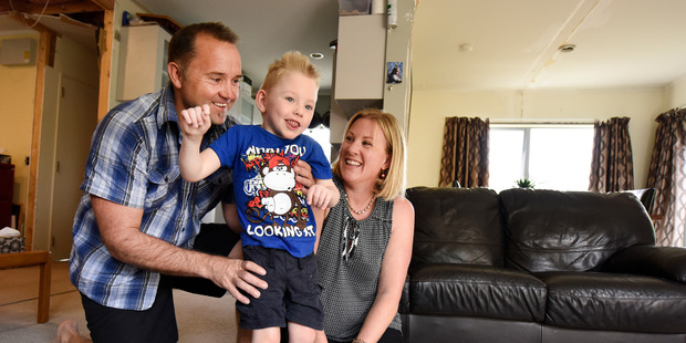 James Reid, 6, with his parents Don and Sonja after his surgery in America. Photo/George Novak