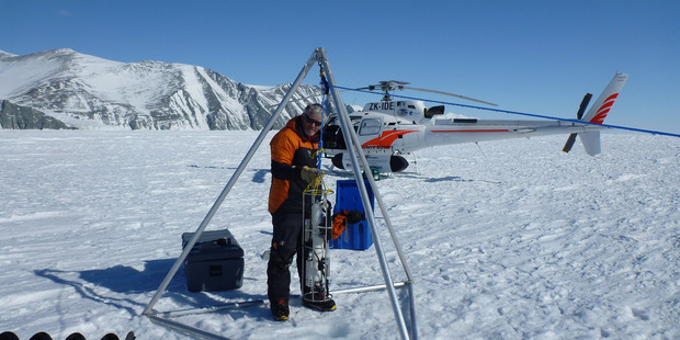 K800: A pilot study led by Professor Gary Wilson has been carried out at Cape Adare, at the northern tip of the Ross Sea, toward a long-term ecological and monitoring programme. He is pictured lowering an instrument into a sea ice hole to measure salinity. Photo / Andrew Hefford