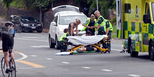 The cyclist about to be lifted on to a stretcher. Photo/Andrew Warner