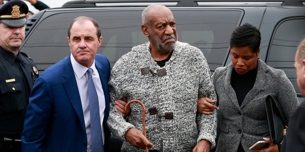 Bill Cosby, pictured being helped as he arrives for a court appearance, has filed a petition to have the first sexual assault charge against him dropped.