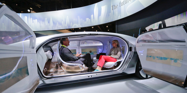 Passengers sit face-to-face in the self-driving Mercedes-Benz F 015 concept car shown off at the International CES in Las Vegas. Photo / AP