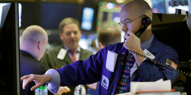 Specialist Jarret Johnson works on the floor of the New York Stock Exchange. Photo / AP