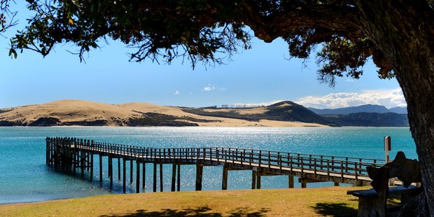 The view over the harbour, sand dunes, and wharf from the Copthorne Hotel Hokianga. Photo / Supplied