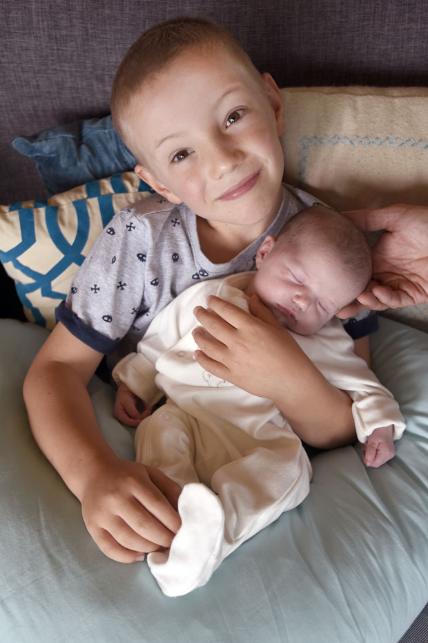 Six-year-old Alex Carratu with his baby sister Nina, who was born New Year's Day. Photo/George Novak