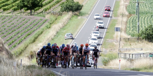Support vehicles line up behind the elite men's road race as riders race up Appley Rd, west of Napier. Photo / Paul Taylor