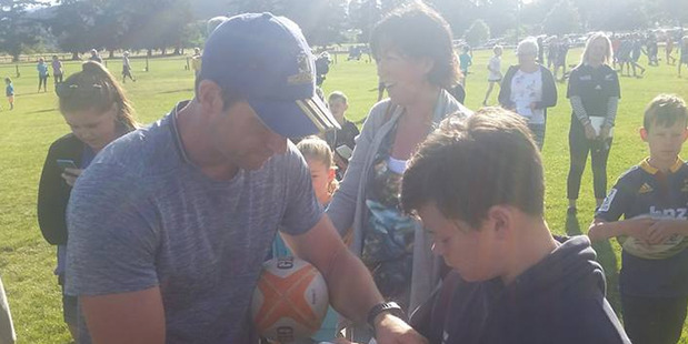 Ben Smith signs an autograph for a young fan following his training session in Wanaka. Photo - Facebook/Joanne White