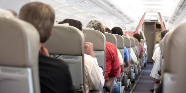 Cabin crew, assisted by willing passengers, restrained the intoxicated defendant by placing handcuffs on him. Photo / iStock
